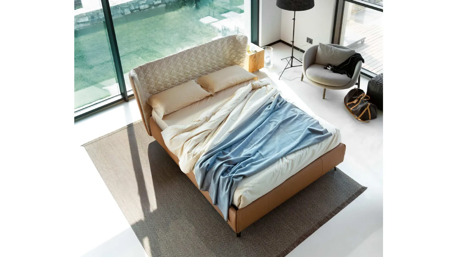 Letto in ecopelle con testiera curva e contenitore Leonte di Noctis