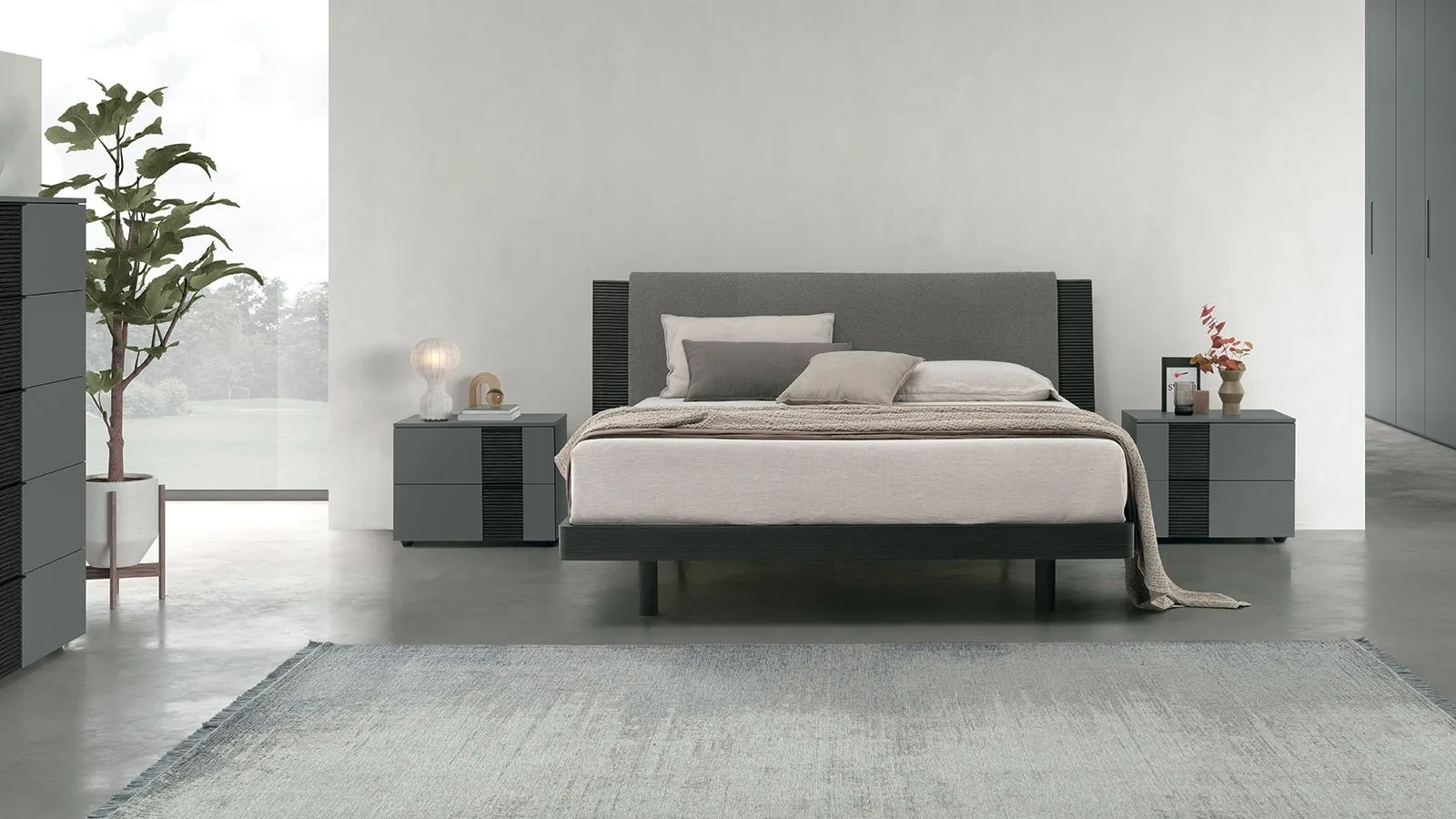Letto matrimoniale Bliss in materico rovere con testiera ammorbidita da un pannello imbottito di Tomasella